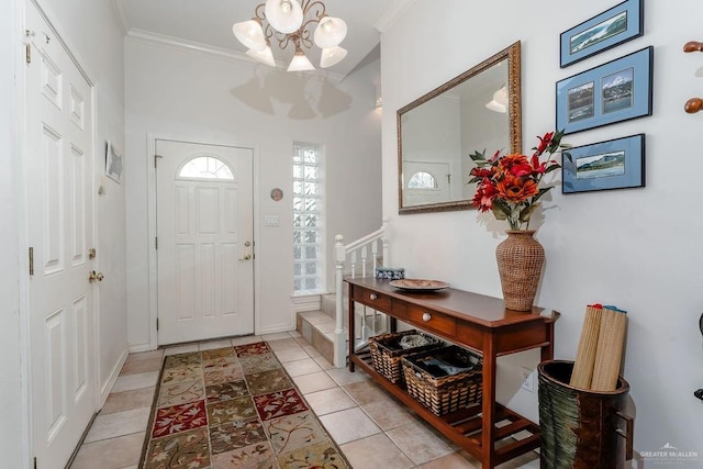 131 E Hibiscus St, South Padre Island, TX 78597 - entryway with a notable chandelier, ornamental molding, and light tile patterned flooring
