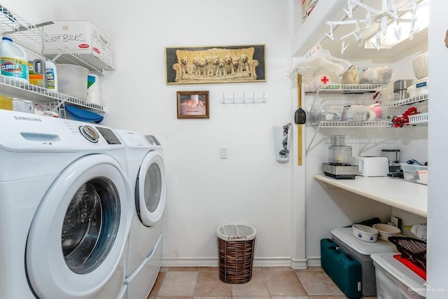 131 E Hibiscus St, South Padre Island, TX 78597 - laundry area with tile patterned floors, laundry area, washing machine and dryer, and baseboards