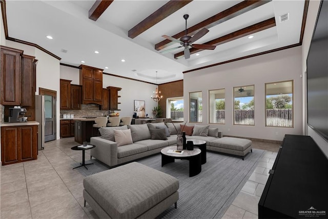 tiled living room with beamed ceiling, a towering ceiling, ceiling fan with notable chandelier, and a healthy amount of sunlight