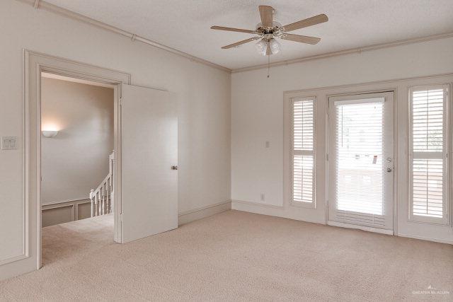 2114 Colorado St, Mission, TX 78572 - unfurnished room with carpet flooring, plenty of natural light, ceiling fan, and crown molding