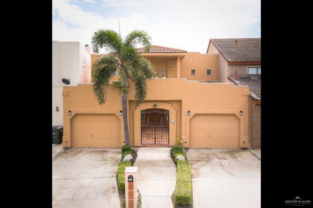 2114 Colorado St, Mission, TX 78572 - view of front of property featuring stucco siding, a garage, driveway, and a tiled roof