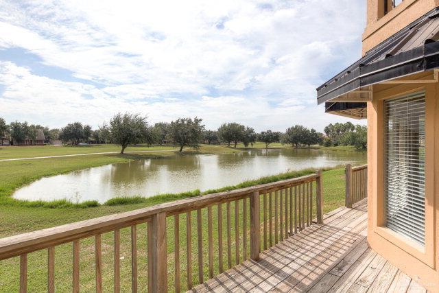 2114 Colorado St, Mission, TX 78572 - wooden deck featuring a water view and a lawn