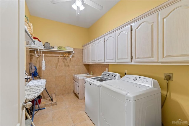 washroom with washer and clothes dryer, cabinets, sink, ceiling fan, and light tile patterned floors