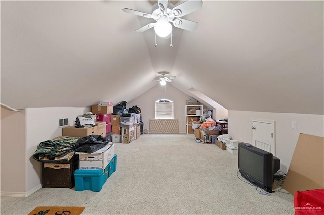 additional living space featuring carpet flooring, ceiling fan, and vaulted ceiling