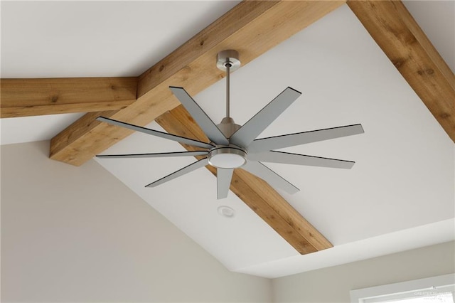 detailed view of beam ceiling and a ceiling fan