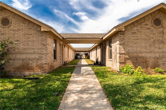 view of home's exterior with a yard