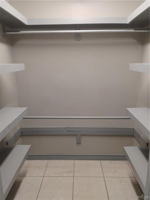 2701 El Barquito Dr, Palmview, TX 78572 - walk in closet featuring light tile patterned floors