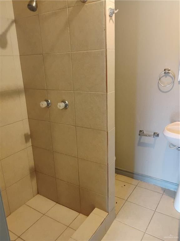 bathroom featuring a tile shower and tile patterned floors