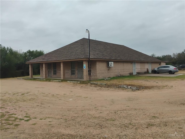 view of side of property featuring a porch