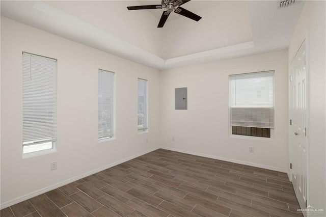 1615 W B St, Mission, TX 78572 - spare room with electric panel, healthy amount of natural light, ceiling fan, and dark wood-type flooring