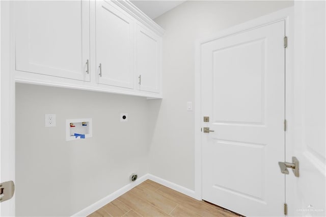 2205 Cardinal Dr, Weslaco, TX 78596 - washroom featuring cabinet space, hookup for an electric dryer, washer hookup, and light wood-style floors