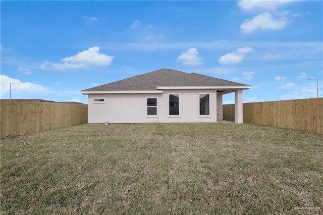2205 Cardinal Dr, Weslaco, TX 78596 - rear view of house featuring a fenced backyard, stucco siding, and a shingled roof
