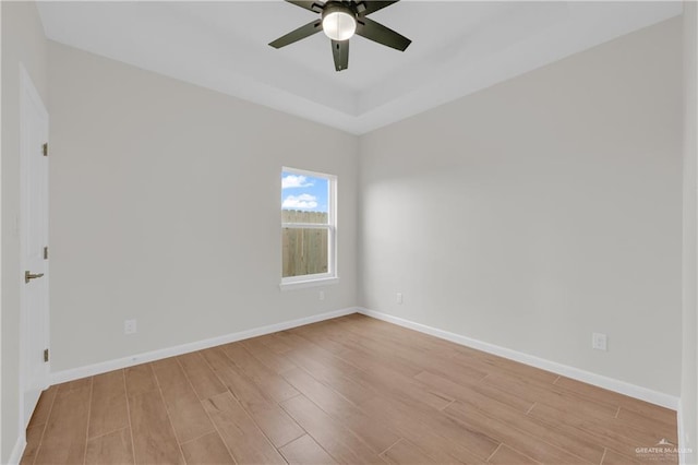 spare room with ceiling fan and light hardwood / wood-style flooring