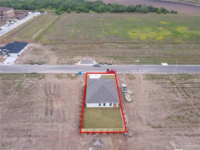 birds eye view of property featuring a rural view