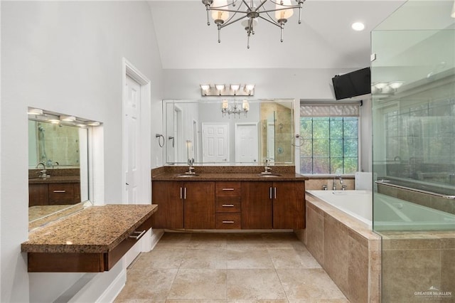 bathroom featuring vanity, separate shower and tub, lofted ceiling, and an inviting chandelier