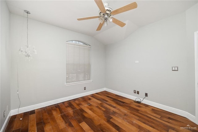 empty room with wood-type flooring, ceiling fan with notable chandelier, and lofted ceiling