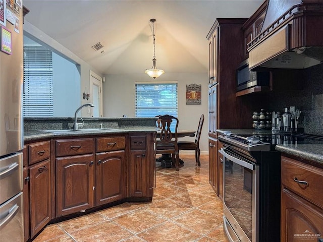 kitchen with appliances with stainless steel finishes, custom range hood, dark brown cabinetry, vaulted ceiling, and sink