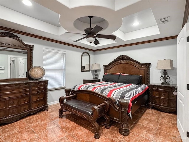 tiled bedroom with a raised ceiling, ceiling fan, and ornamental molding