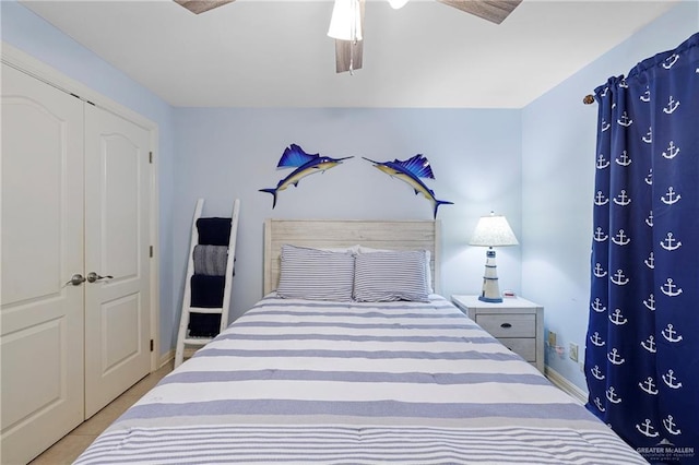 bedroom with ceiling fan and a closet