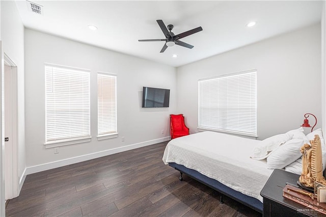 bedroom with ceiling fan and dark hardwood / wood-style flooring