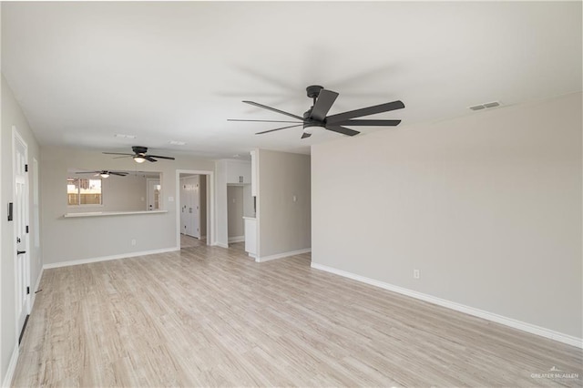 unfurnished living room with ceiling fan and light hardwood / wood-style flooring