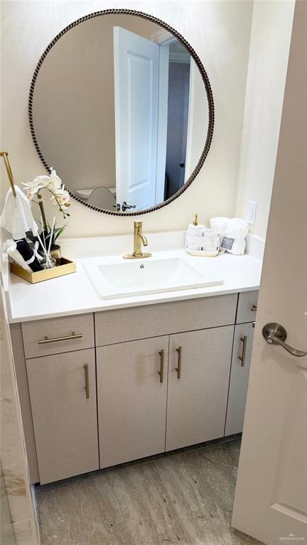 5302 Vision St, Rio Grande City, TX 78582 - bathroom featuring vanity and wood finished floors