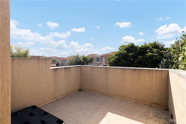 view of patio featuring a balcony