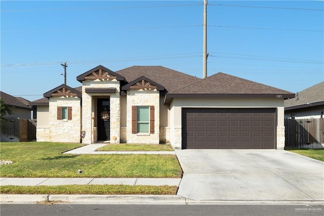 view of front facade featuring a front yard and a garage