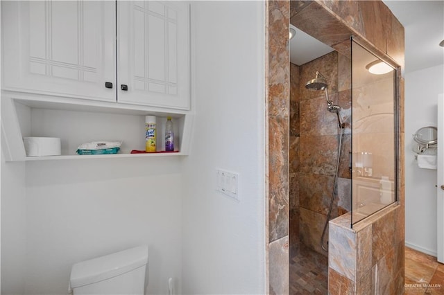 bathroom with walk in shower and toilet