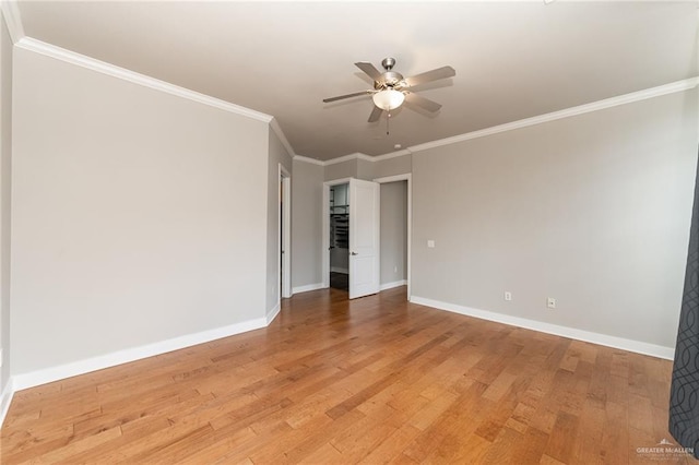 spare room featuring ceiling fan, ornamental molding, and hardwood / wood-style flooring