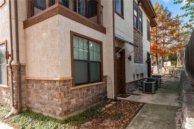 doorway to property featuring central AC