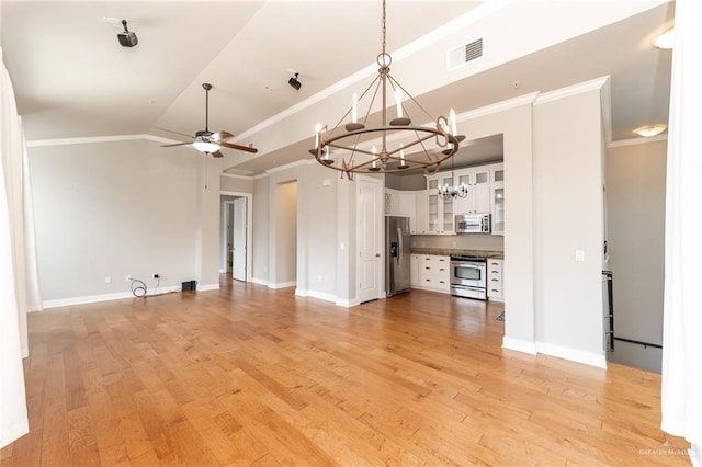 unfurnished living room with ceiling fan with notable chandelier, light hardwood / wood-style floors, crown molding, and vaulted ceiling