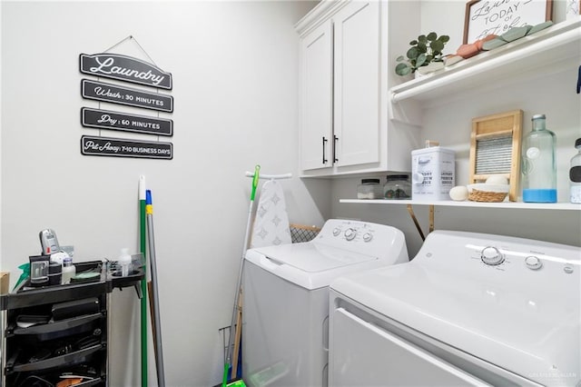 laundry room with cabinets and washing machine and dryer