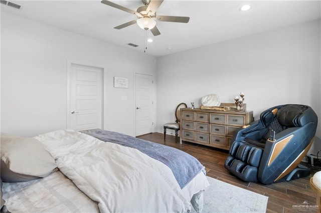 bedroom featuring dark hardwood / wood-style floors and ceiling fan