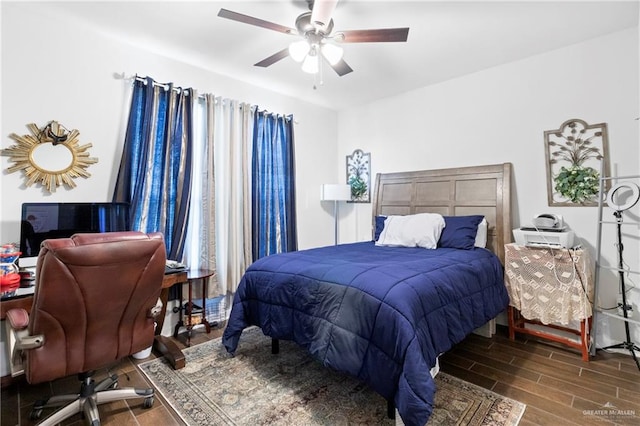 bedroom featuring dark hardwood / wood-style floors and ceiling fan