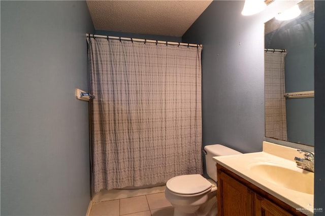 1306 Denver St, Edinburg, TX 78541 - full bath with vanity, tile patterned flooring, a textured ceiling, and a shower with shower curtain