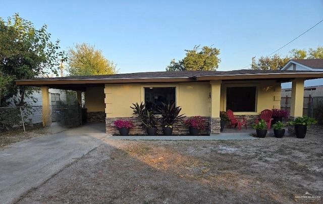 rear view of property featuring a carport