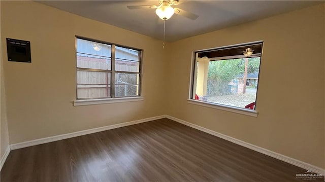 unfurnished room with ceiling fan and dark hardwood / wood-style floors