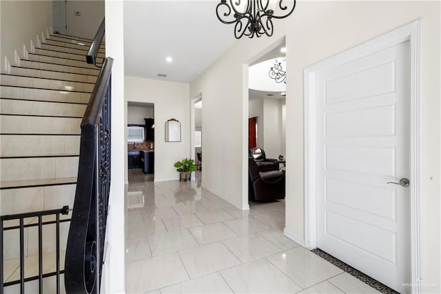4805 Galilea St, Edinburg, TX 78542 - hall with a chandelier, baseboards, stairs, recessed lighting, and light marble finish flooring