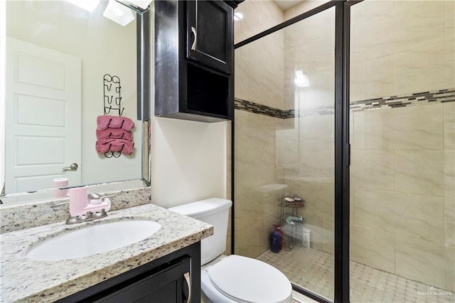 4805 Galilea St, Edinburg, TX 78542 - bathroom featuring a stall shower, toilet, and vanity