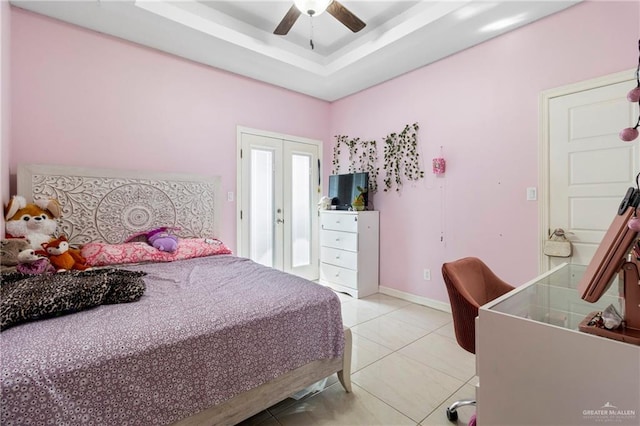 4805 Galilea St, Edinburg, TX 78542 - bedroom with light tile patterned floors, a ceiling fan, baseboards, french doors, and a raised ceiling
