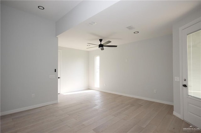 empty room featuring ceiling fan and light wood-type flooring