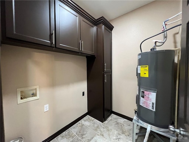 washroom featuring cabinet space, baseboards, hookup for a washing machine, and electric water heater