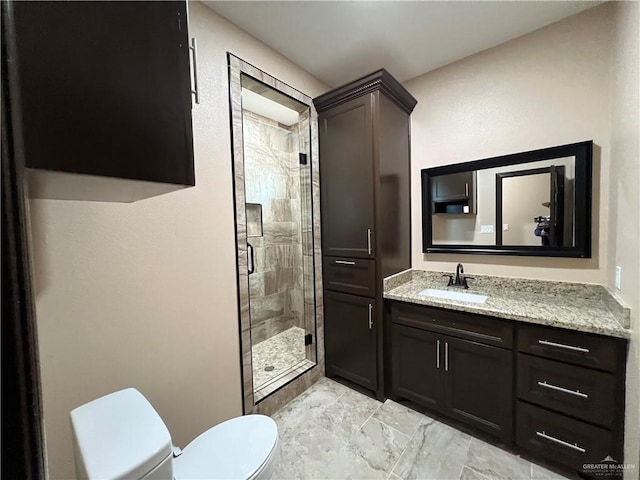 full bath featuring vanity, marble finish floor, toilet, and a shower stall