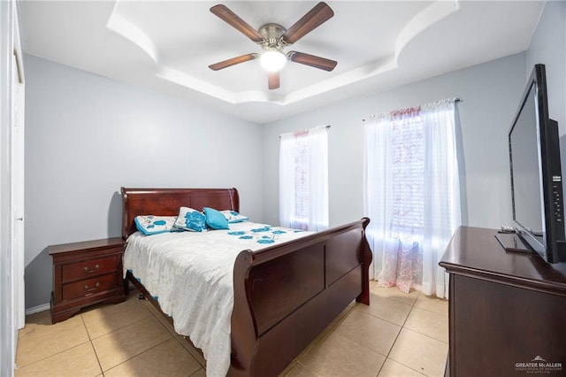 2103 Obra Dorado Rd, Mission, TX 78572 - bedroom featuring a raised ceiling, light tile patterned floors, and ceiling fan