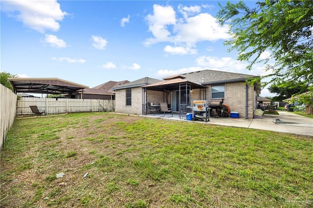 2103 Obra Dorado Rd, Mission, TX 78572 - back of house with brick siding, a fenced backyard, and a patio area