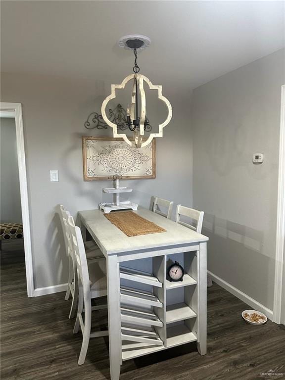 dining room featuring a chandelier and dark hardwood / wood-style flooring