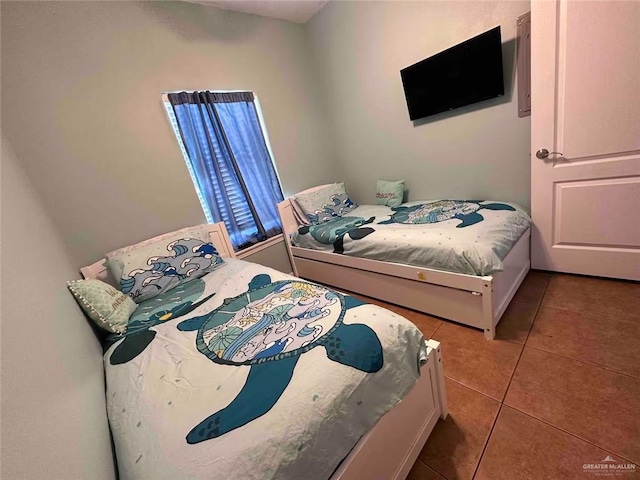 bedroom featuring light tile patterned floors