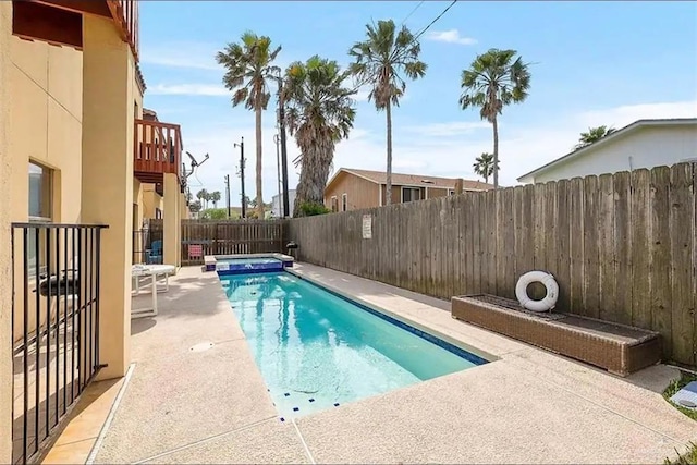 view of swimming pool with a patio