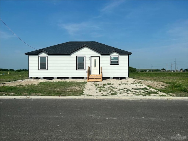 121 N Kentucky St, Mission, TX 78573 - manufactured / mobile home with roof with shingles and entry steps